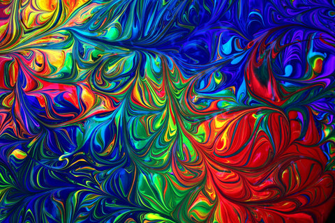 Poster paint swirled into a fantastic psychedelic pattern with loads of bright rainbow colors