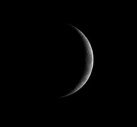 Crescent at the sky, new moon, dark background