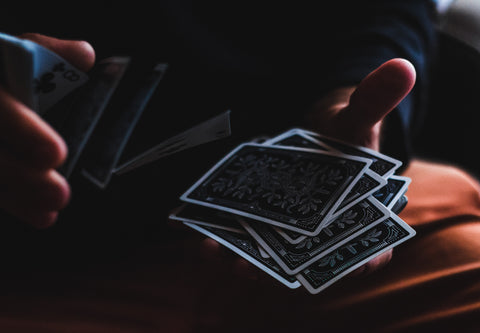 close up of person shuffling cards