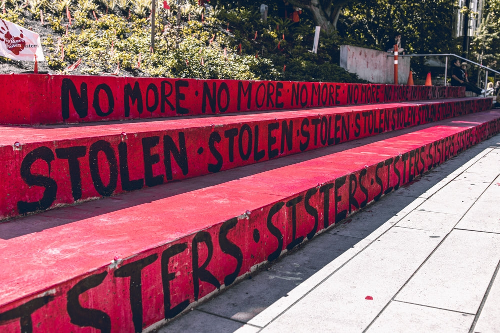 Vancouver, Canada - July 1, 2022: A sign with text "No more stolen sisters" on the Robson Square. Memorial to honour Missing and Murdered Indigenous Women in US and Canada