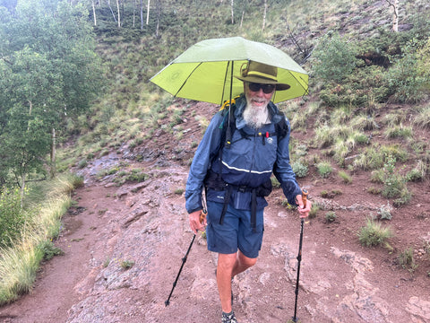 Hawkeye walking down the trail with the umbrella deployed