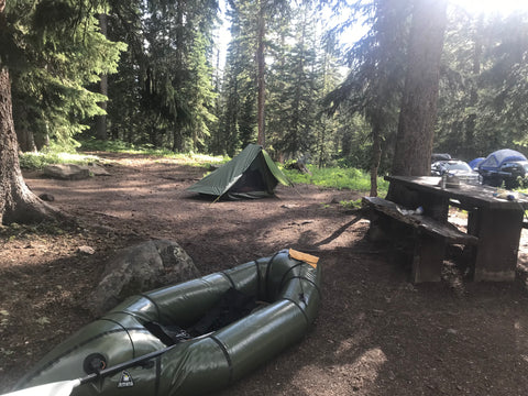Raft and Trekker set up in camp