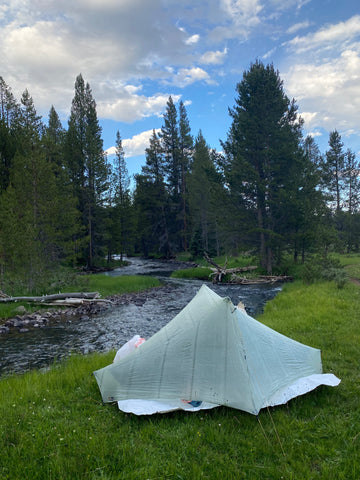 tent next to a river