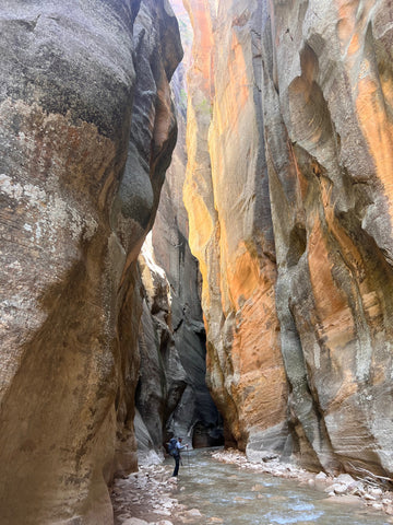 a hiker in a slot canyon