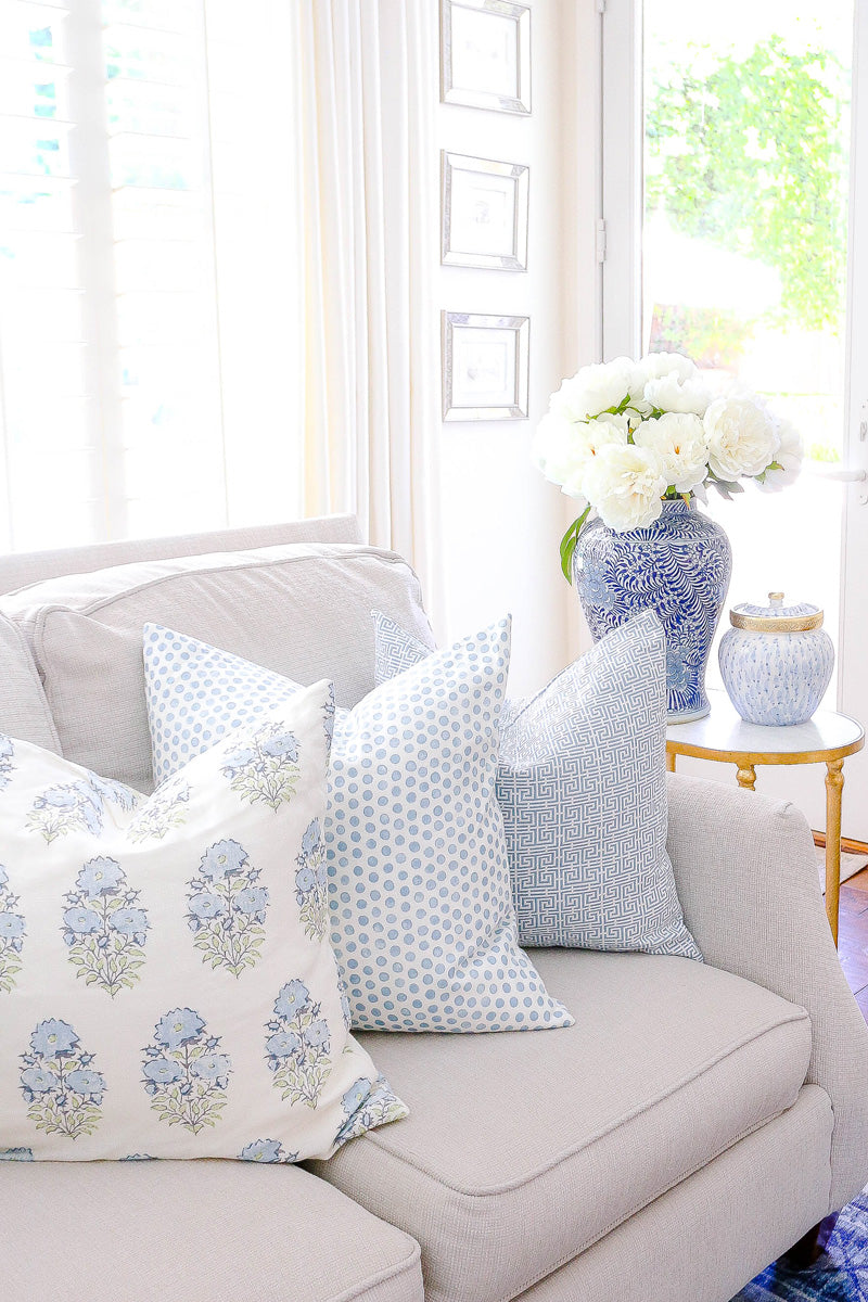 Blue and white patterned pillow for spring living room decor | design by Randi Garrett