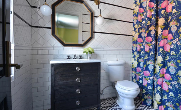 black and white bathroom with subway tile, patterned floor, floral designer fabric shower curtain | Designer Spotlight: Meredith Heron | Arianna Belle Blog