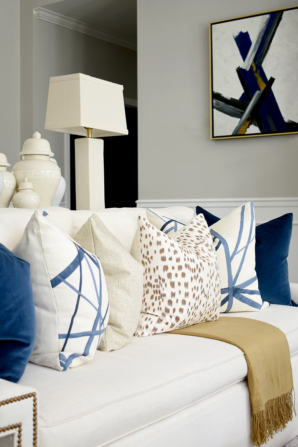 Designer pillow combo of rich gold and brown tones paired with navy and cream | from Arianna Belle