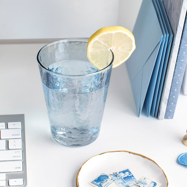 5 Self Care Ideas: Elevate Your Hydration | beautiful blue glass with lemon water