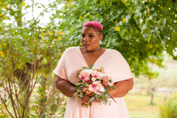 Latoya Taylor, plus size model in Henkaa Apricot Coral Sakura Maxi.