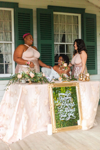 Henkaa bride and bridesmaids laugh together in their Henkaa convertible dresses.