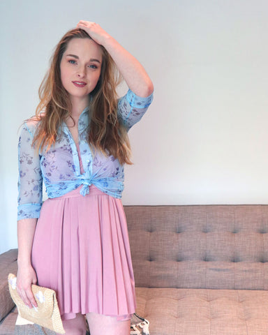Kate Maranduik wearing the Henkaa Sakura Midi Convertible Dress in Dusty Rose. She's wearing it in a strapless style with a sheer blue button up top over it.
