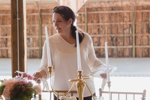 Michelle styling a Alice in Wonderland themed styled shoot.