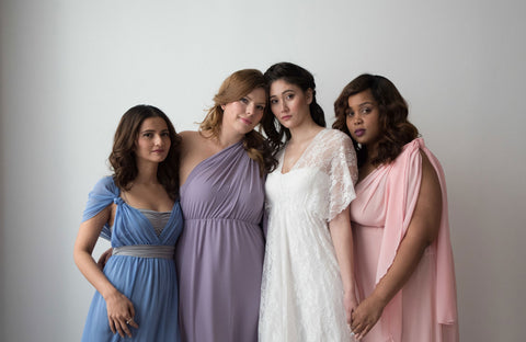 Models wearing the Henkaa Daffodil Convertible Lace and Chiffon Dress in Dusty Blue, Dusty Purple, Blush Pink and one model wearing the Daffodil Lace Wedding Dress.