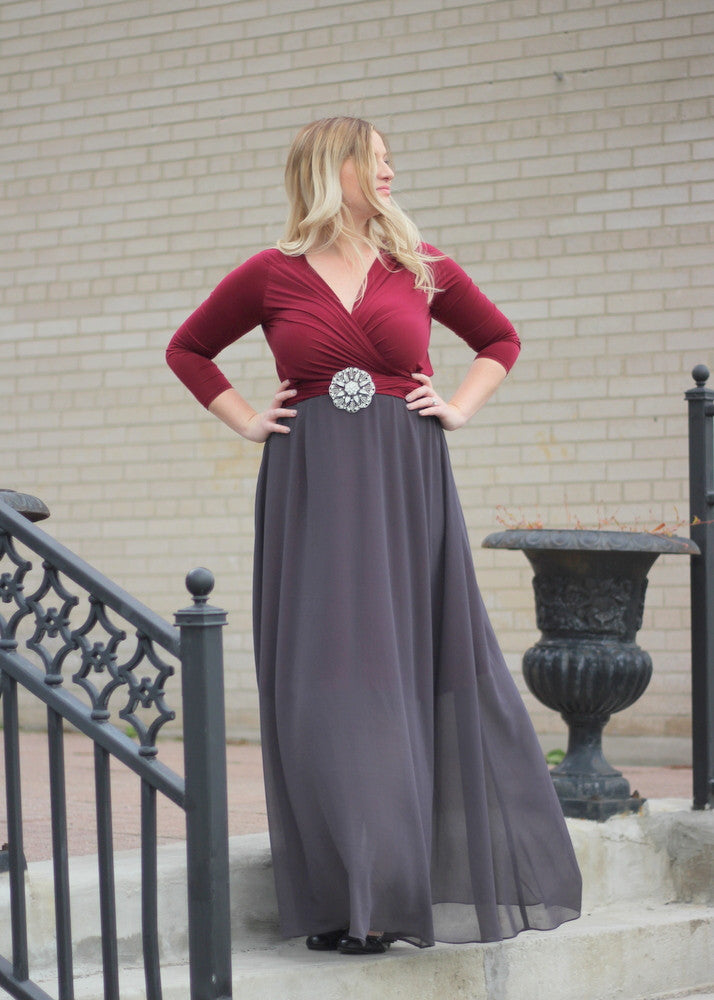 5 Mother's Day outfit ideas: blonde woman wearing a scarlet Henkaa dress and a dark grey convertible overlay.