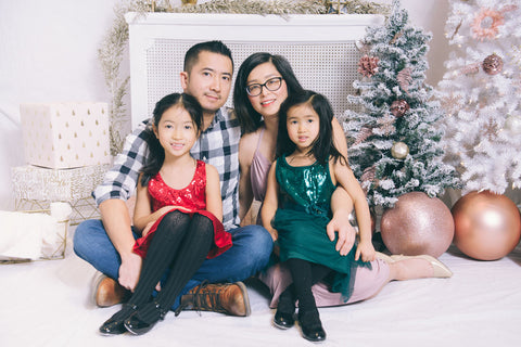 Sonia and her family posing for Christmas photos