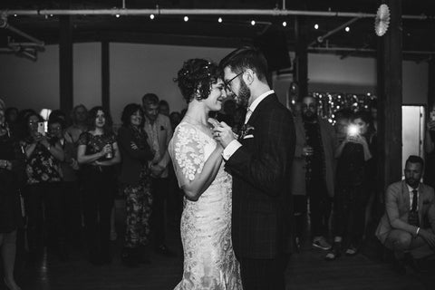 Averie MacDonald and Bled Celhyka have their first dance, photo is in black and white.