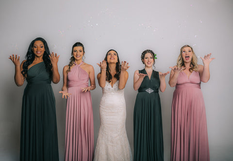 Bride and wedding attendees wearing Henkaa infinity dresses