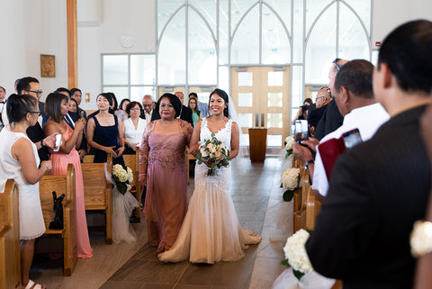 Kristina walks down the aisle with her mother at St. Josephine Bakhita Church in Mississauga.