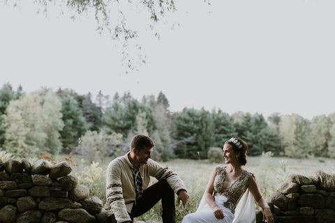 The Melniks sit on a rock fence in the field of Alexs parents house in Caledon Ontario.