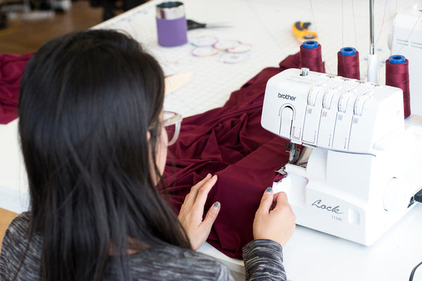 Sam, Henkaa's designer works at the sewing machine.