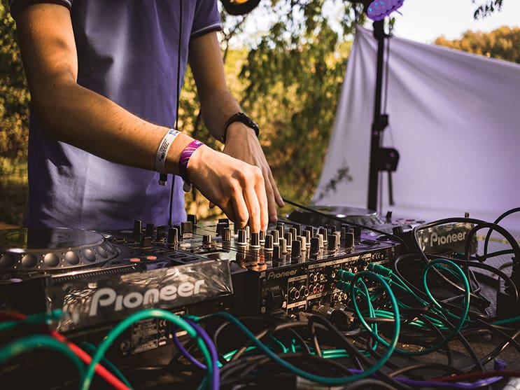 DJ using custom wristbands