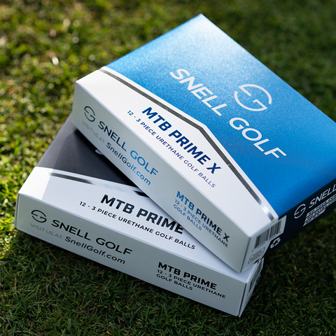 new golf balls MTB prime and Mtb prime x, blue box of golf balls, black box of golf balls