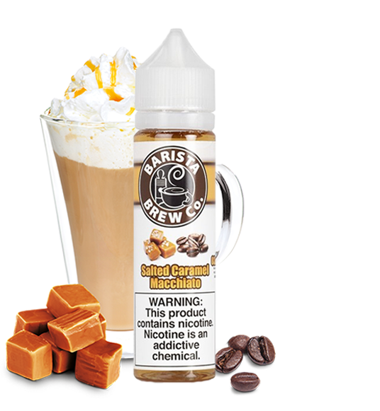 Barista Brew Co. - Salted Caramel Macchiato - 60ML Vape Juice - 60ML slim plastic bottle surrounded by several coffee beans and caramel squares, plus a glass of light brown coffee topped with whipped cream.