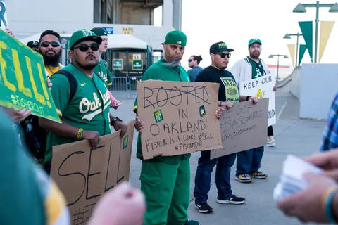 Oakland A's fans protesting outside the stadium in an attempt to convince owner John Fisher to sell the team in order to keep them in Oakland.