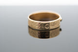 Eagle ring .25 of an inch in width and presented in a size 13