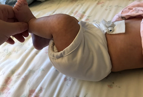 preemie baby in cloth diaper warp