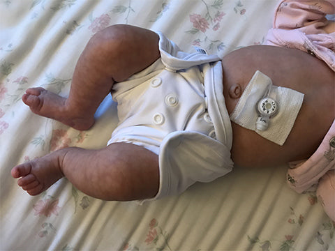 premature baby in preemie diaper cover