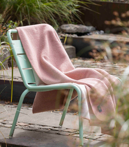 doubleface boiled wool rose disana blanket on a chair