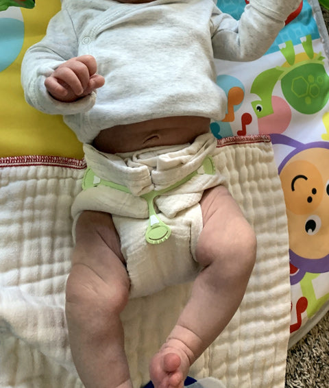 muslin flat diaper on 9 pound newborn baby