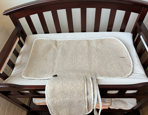 wool changing pad on a changing table