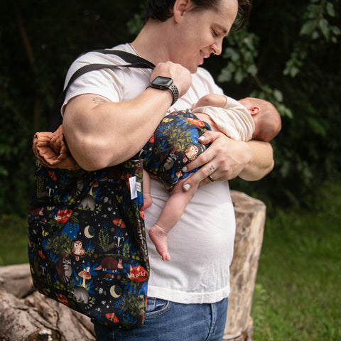 Thirsties simple tote reusable bad and dad holding newborn baby