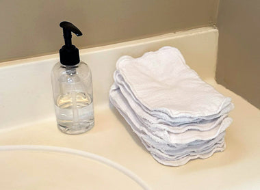 pump bottle and cotton wipes in bathroom