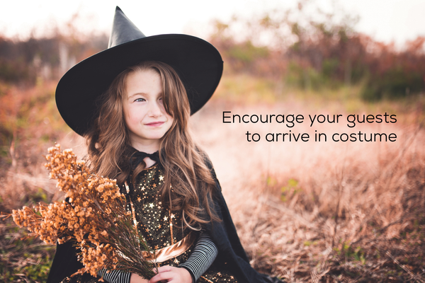 Girl wearing a witch costume.