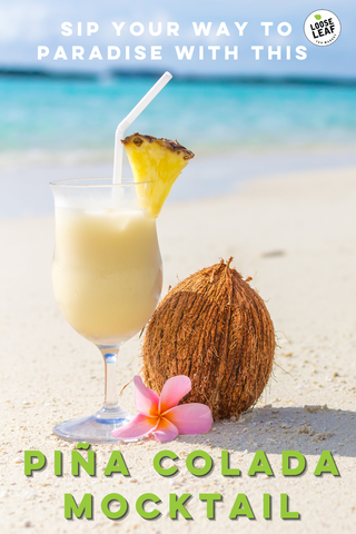 healthy vegan pina colada in tall glass with pineapple piece and straw sitting next to coconut on the beach graphic