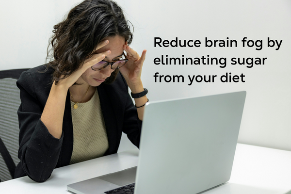 Woman looking stressed working at her computer.