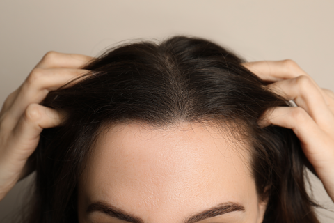 woman with hands in dry hair