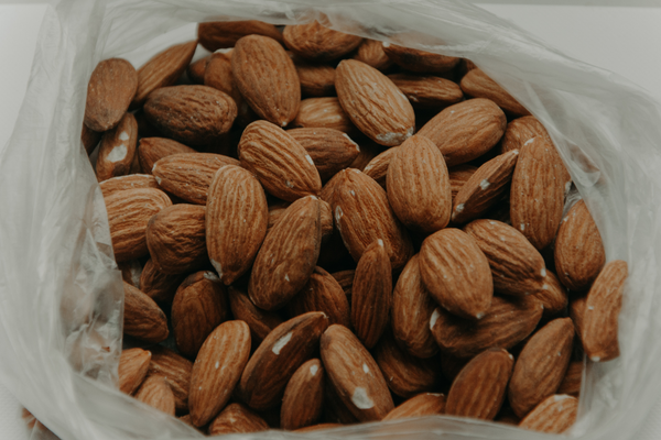 aesthetic picture of plain almonds in a bag