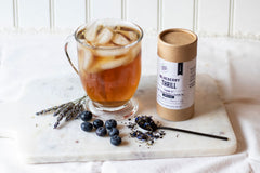 brewed blueberry thrill with canister, fresh blueberries and dried lavender