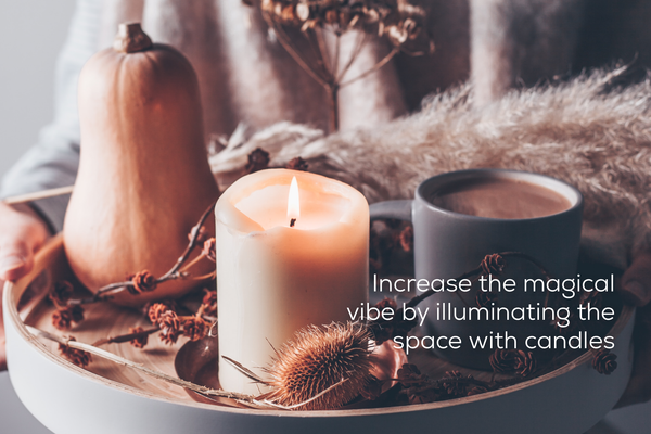 Tray with tea, candle, squash, and autumn decor.