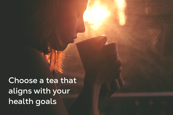 Woman holding a cup of tea.