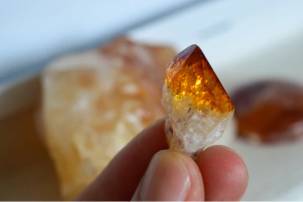 citrine stone in hand for wealth