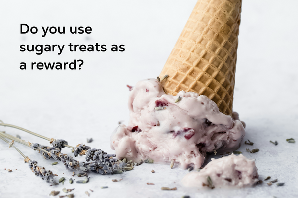 A spilled ice cream cone with lavender flowers.