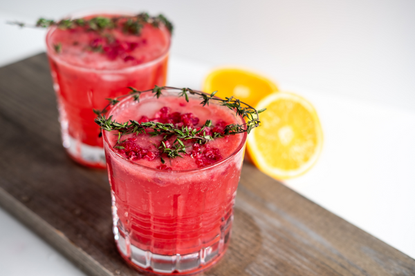 delicious and sweet pink mocktail with rosemary and lemon