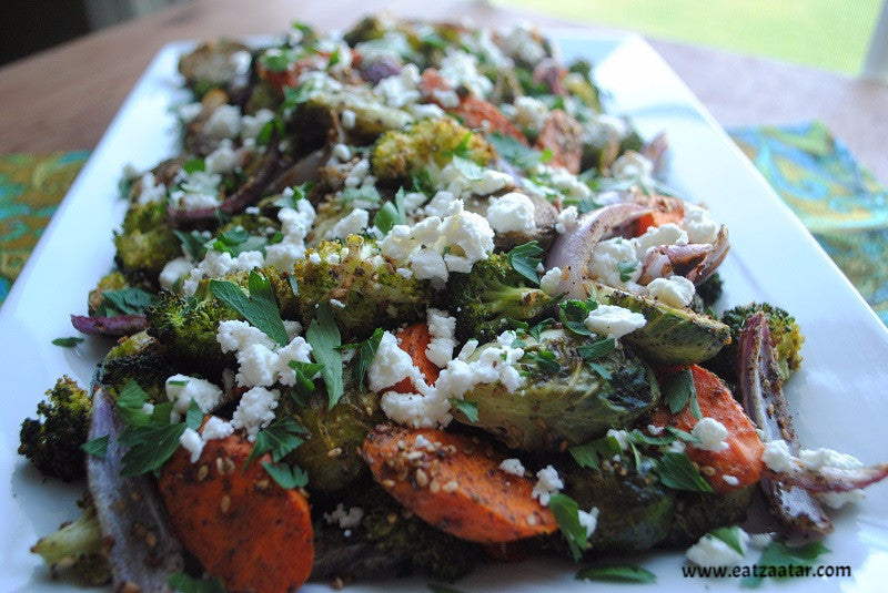 zaatar roasted vegetables with goat cheese ready to serve close up