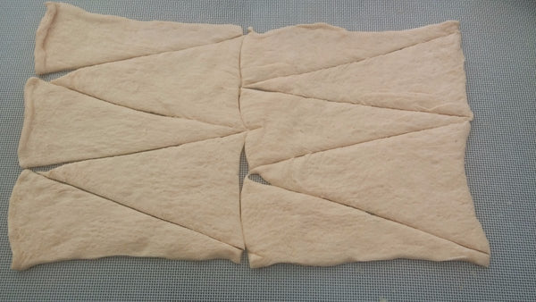 Zaatar recipe step 3 - crescent dinner rolls sheet cut into triangle pieces