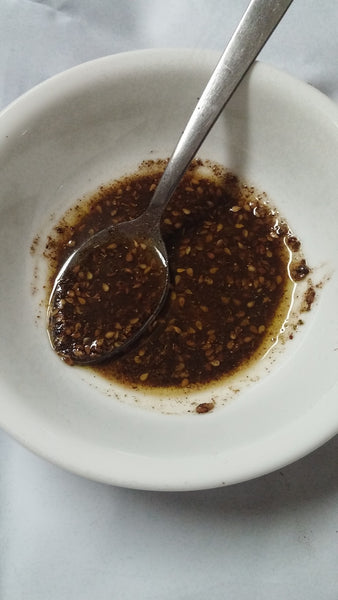 zaatar crescent rolles recipe : zaatar mix with olive oil in a bowl